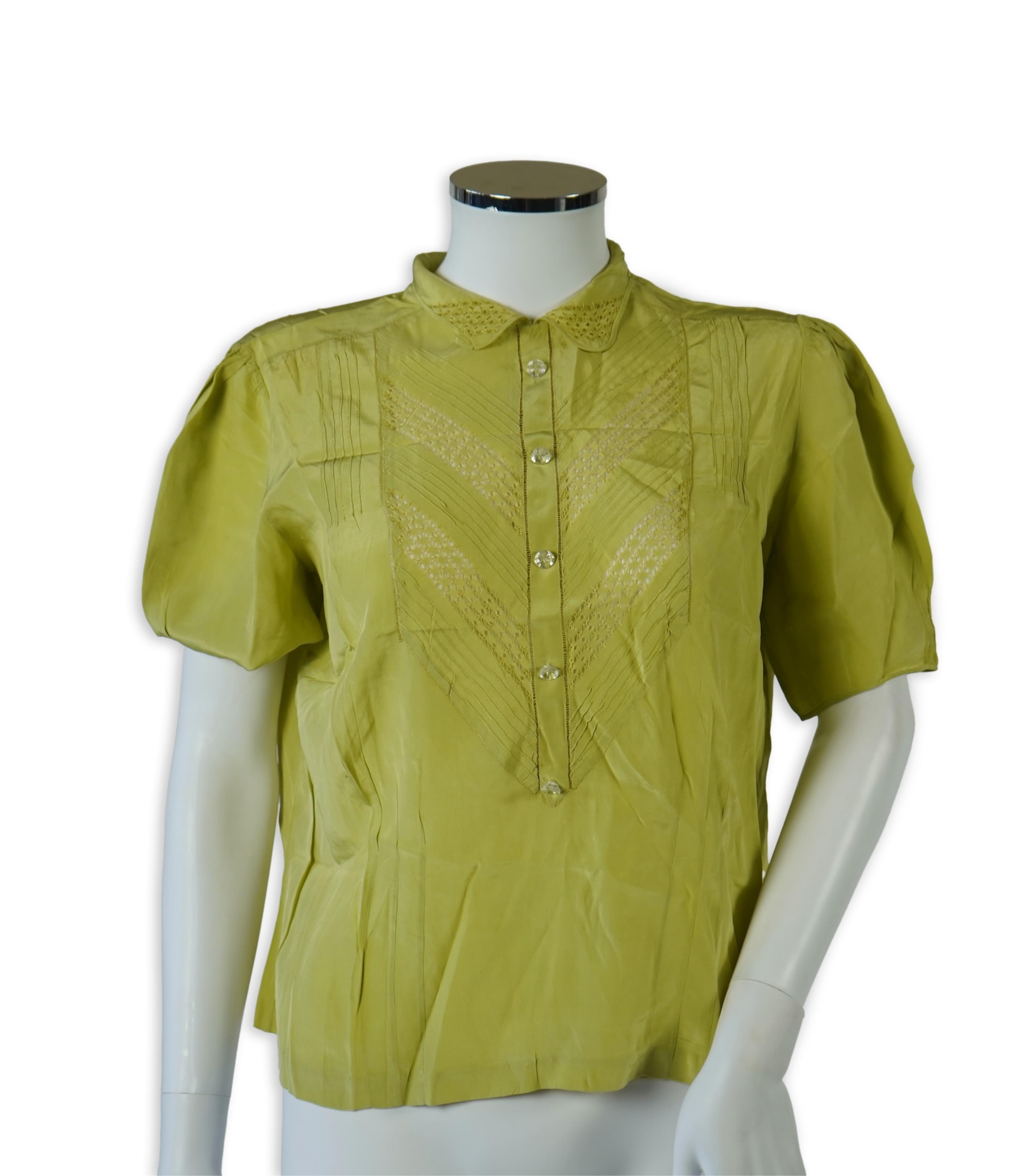 A 1940’s-50’s short sleeve lime green silk embroidered blouse, a pale pink silk crepe long sleeved blouse with white lace and a late 19th century navy silk chiffon blouse. Condition - the navy blouse is fragile but may b